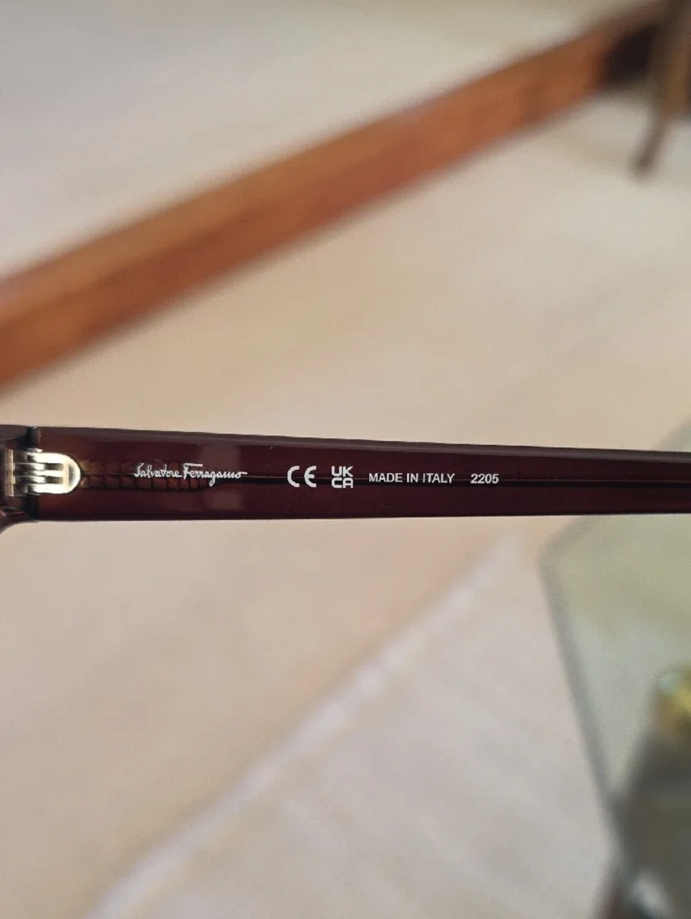 Salvatore Ferragamo SF1066S sunglasses feature a dark crystal brown frame